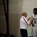 Milan Head Coach Josh Tropea pulls aside sophomore Latin Davis to talk at halftime on Friday. Daniel Brenner I AnnArbor.com